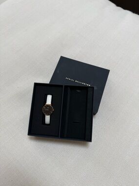 Daniel Wellington Black Dial Watch with Rose Gold Case and White leather Strap